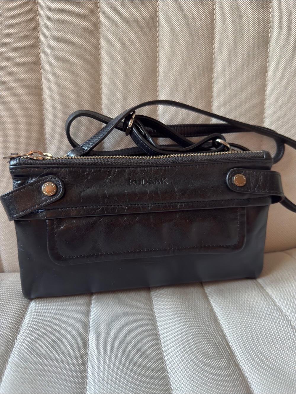 RUDSAK Black Leather Slim Crossbody with Gold Hardware